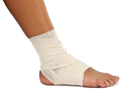 14805063 Injured Ankle With Bandage On A White Background