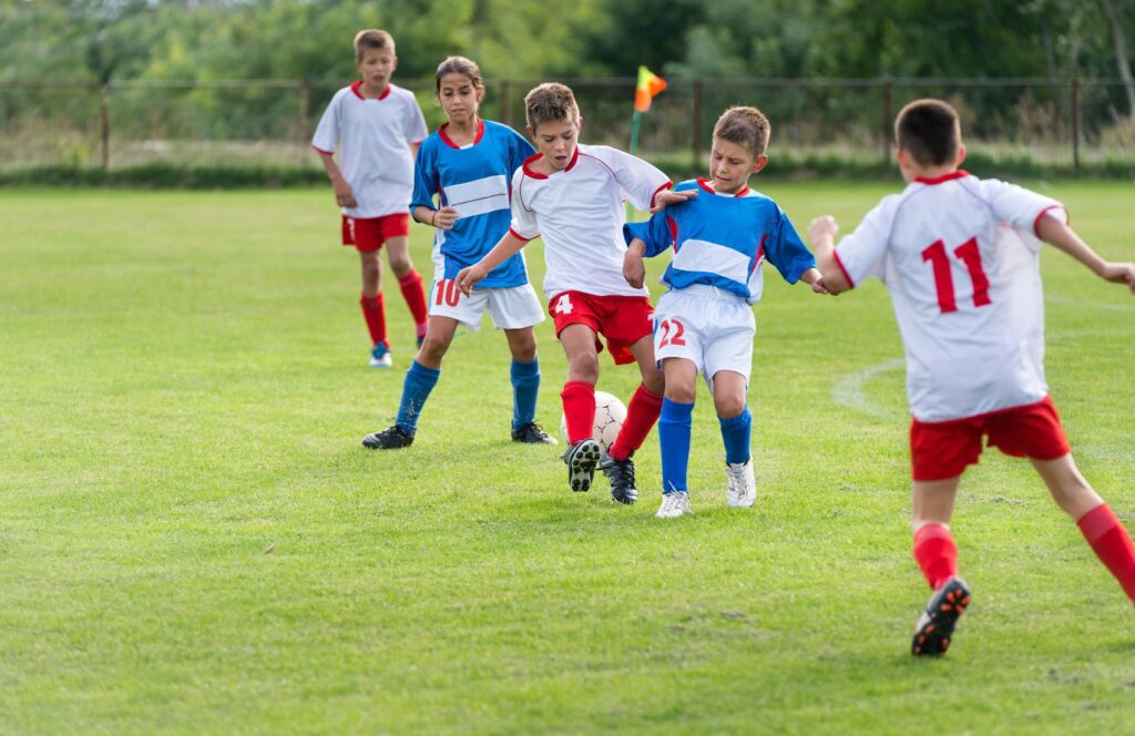 22428788 L Kids Playing Soccer Sports Children Team Ball Field